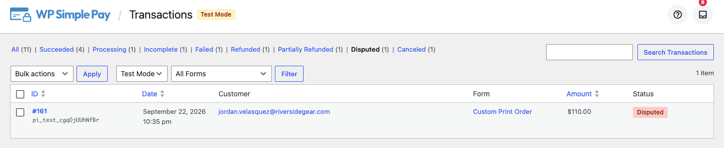 The Transactions page filtered to the Disputed view, showing a payment marked with a disputed status badge